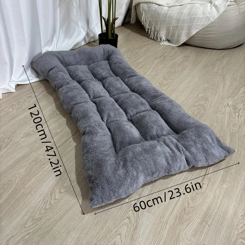 Oversized Plush Sofa Dog Bed draped over a sofa arm showing its soft plush fabric texture