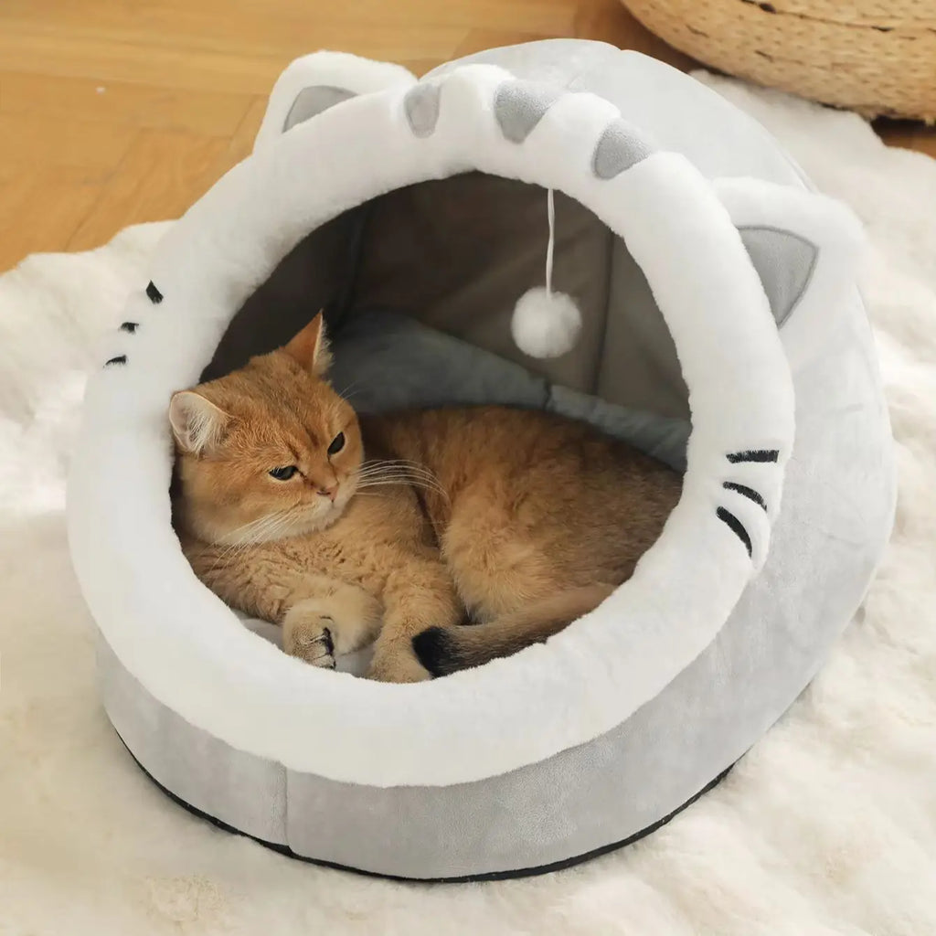 Grey cat-face shaped Cosy Cave Cat Bed with two ginger cats curled up sleeping inside together